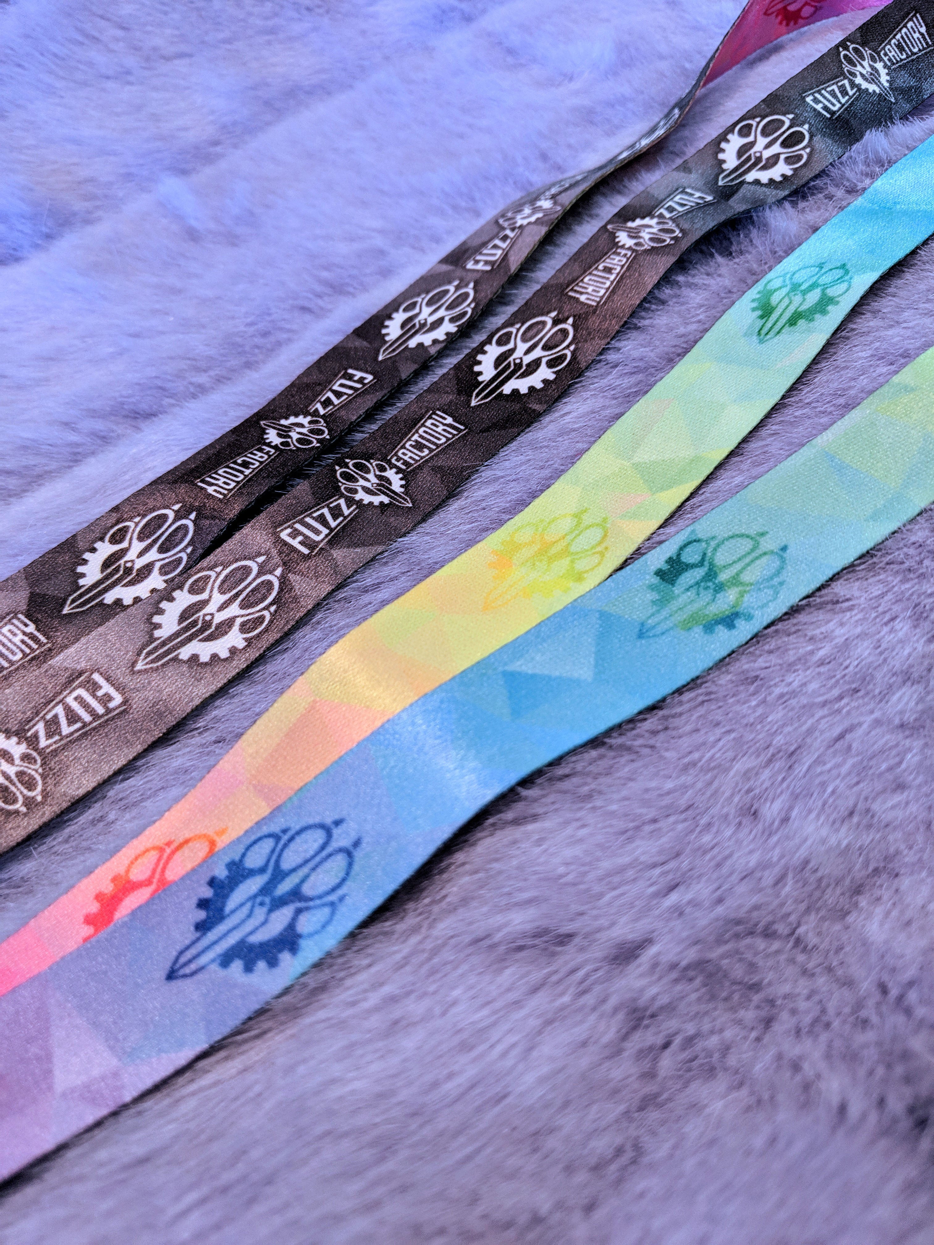 Colorful Fuzz Factory branded lanyards fur surface